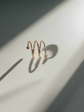 Adjustable twist spring ring